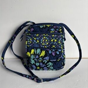 This is a Vera Bradley Mini Hipster crossbody bag in the Indigo Pop pattern.